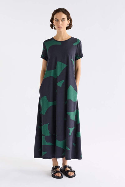 Woman wearing a darkl dress with green pattern on a white background by ELK the Label | Elk Stockist in Newcastle, NSW