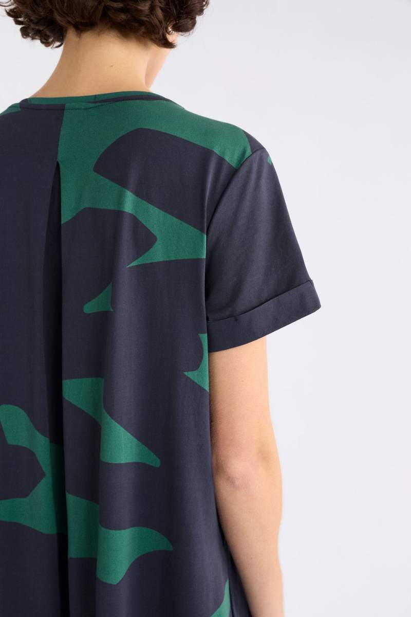 Woman wearing a darkl dress with green pattern on a white background by ELK the Label | Elk Stockist in Newcastle, NSW