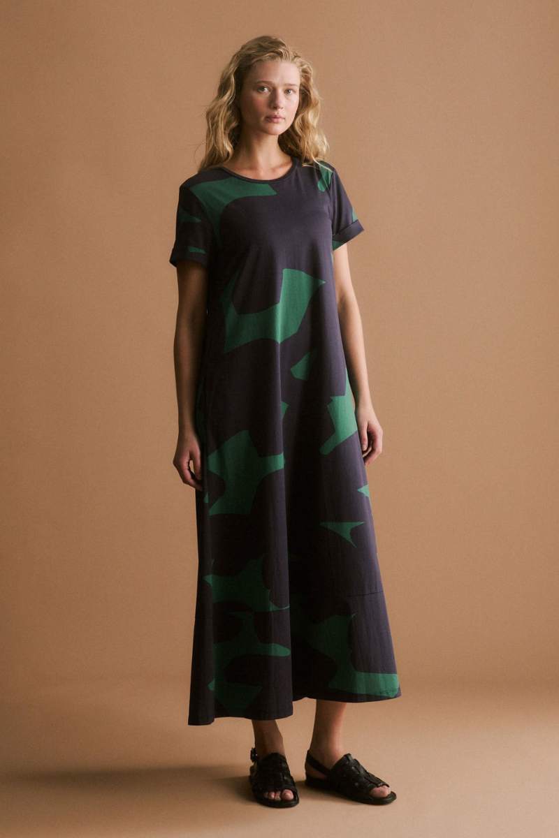 Woman wearing a darkl dress with green pattern on a white background by ELK the Label | Elk Stockist in Newcastle, NSW