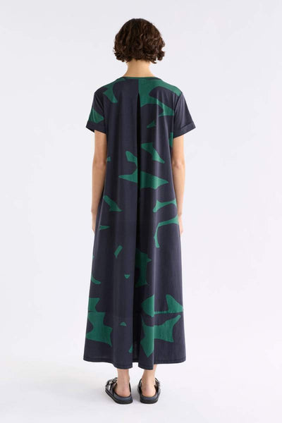 Woman wearing a darkl dress with green pattern on a white background by ELK the Label | Elk Stockist in Newcastle, NSW
