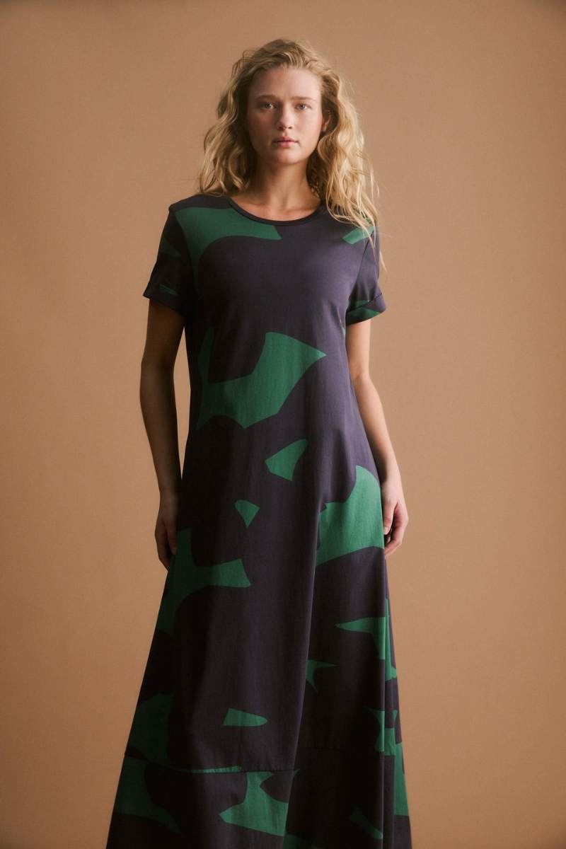Woman wearing a darkl dress with green pattern on a white background by ELK the Label | Elk Stockist in Newcastle, NSW