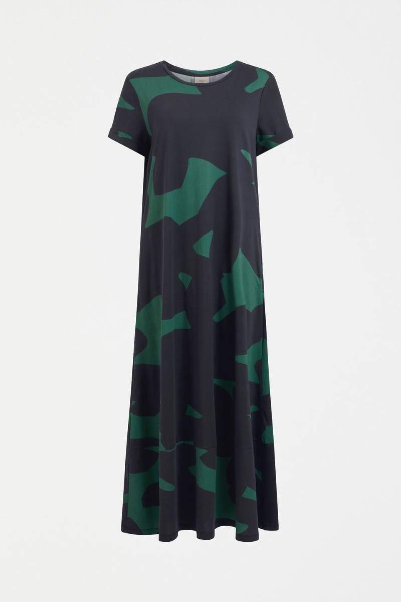Woman wearing a darkl dress with green pattern on a white background by ELK the Label | Elk Stockist in Newcastle, NSW