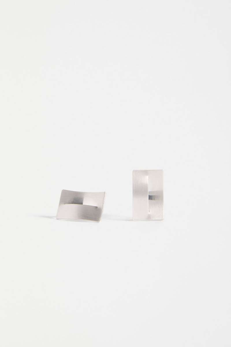 Two metallic square objects on a white background - Trel Stud Earrings by Elk The Label. ELK Stockist in Newcastle, NSW at Zebra Finch Style