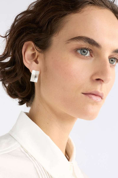 Close-up of a person wearing a square earring on a plain background - Trel Stud Earrings by Elk The Label. ELK Stockist in Newcastle, NSW at Zebra Finch Style
