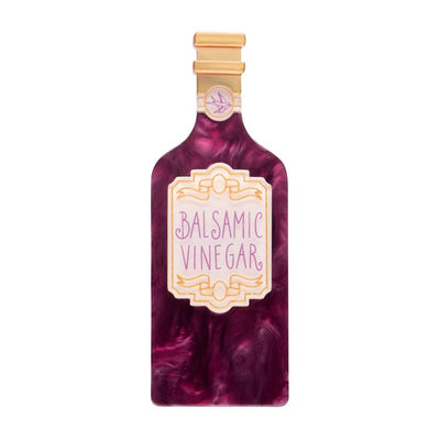 Bottle of balsamic vinegar with a marbled design on a white background - resin brooch by Erstwilder from their 2025 Condiments collection