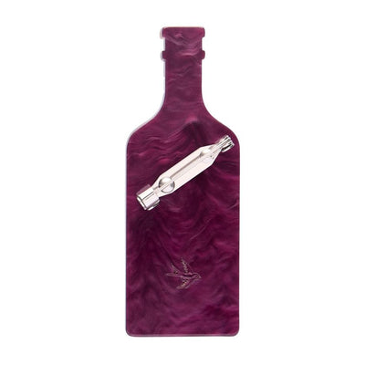 Bottle of balsamic vinegar with a marbled design on a white background - resin brooch by Erstwilder from their 2025 Condiments collection