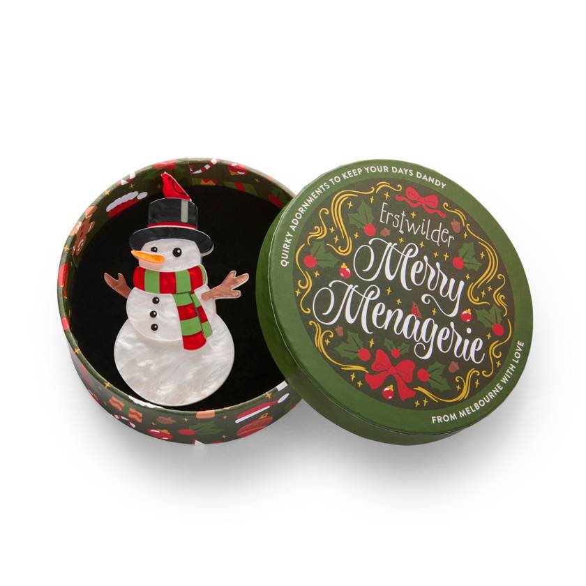 Decorative snowman with a red scarf, black top hat, and small bird on a white background | Erstwilder brooch from their 2025 Christmas collection