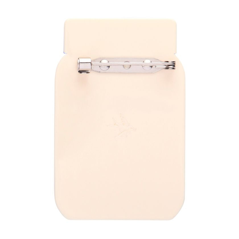 Jar of whole egg mayonnaise with a blue lid on a white background. Mayonnaise brooch by Erstwilder from their 2025 Condiments collection