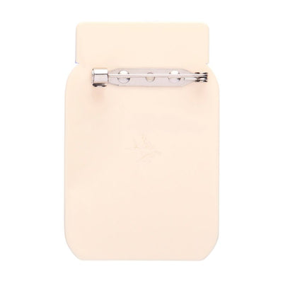 Jar of whole egg mayonnaise with a blue lid on a white background. Mayonnaise brooch by Erstwilder from their 2025 Condiments collection