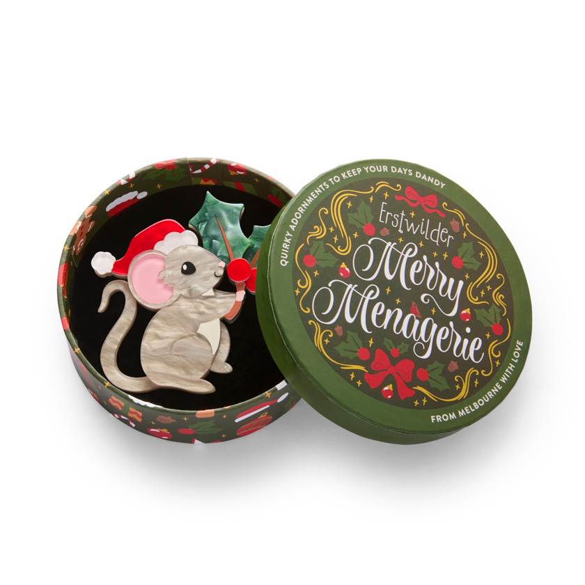 Illustration of a mouse wearing a Santa hat and holding holly leaves and berries on a white background | Resin brooch by Erstwilder from their 2025 christmas Merry Menagerie collection