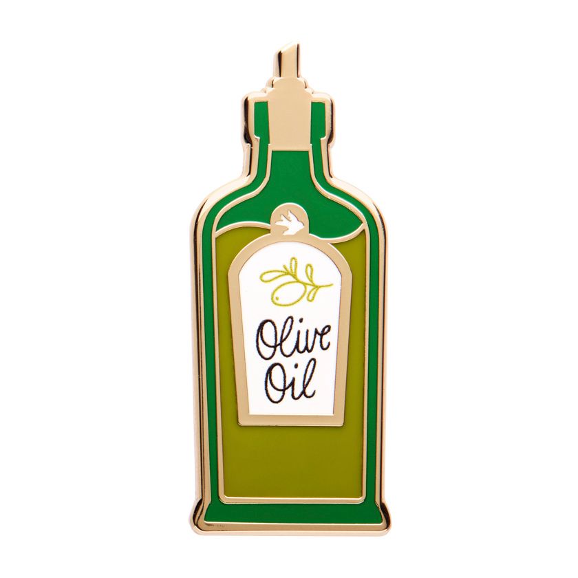 Enamel pin shaped like an olive oil bottle with a label on a white background - from Erstwilder's 2025 Condiments collection