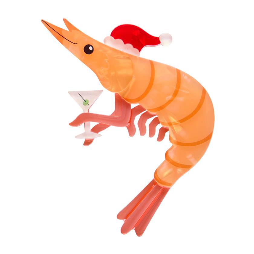 Shrimp wearing a Santa hat with a cocktail on a white background | Erstwilder brooch from their 2025 Christmas collection