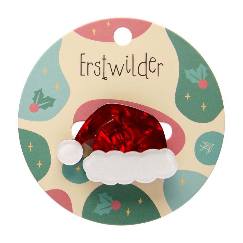 Round decorative item with a Santa hat design on a colorful background, featuring the brand 'Erstwilder'.