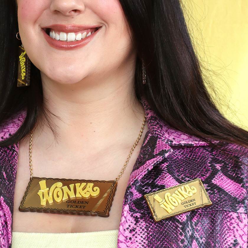 Golden Ticket Wonka Bar Brooch by Erstwilder from their December 2024 Willy Wonka and The Chocolate Factory collection on model