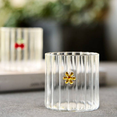 Clear glass tumbler with a yellow flower by Robert Gordon | Robert Gordon Stockist in Newcastle, NSW