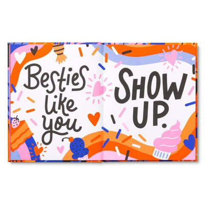 Colorful box with 'Besties like you show up' text and abstract designs on a white background