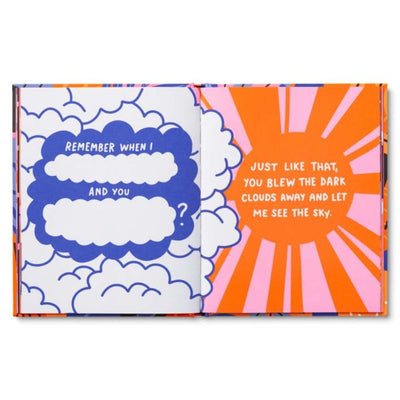 Colorful book with cloud and sun design on a white background