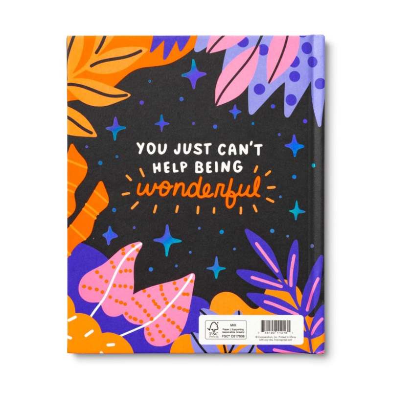 Notebook with colorful design and motivational quote on a white background