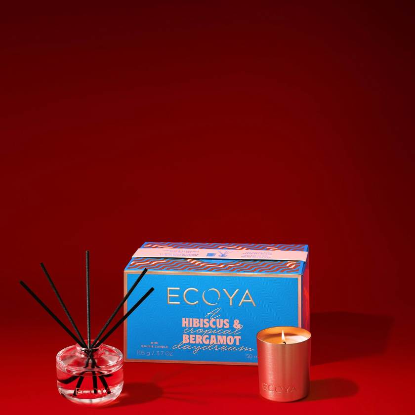 Ecoya candle and diffuser set on a red background