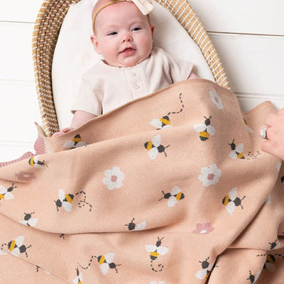 Indus Busy Bee Blanket, featuring tiny bees on a soft pink blanket