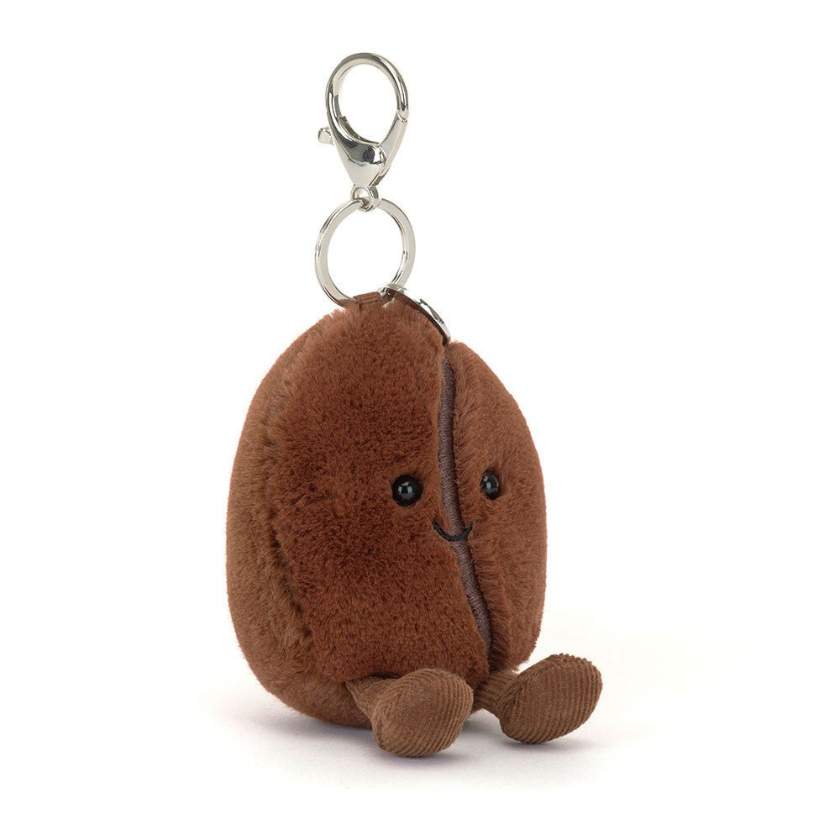 Plush coffee bean keychain with a face on a white background. Jellycat Amuseables Coffee Bean Bag Charm. Jellycat Stockist in Newcastle, NSW at Zebra Finch