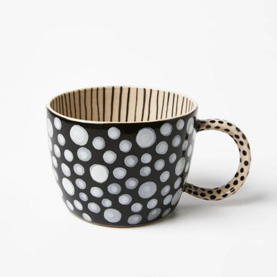 Black mug with white polka dots and beige interior on a white background by jones and Co | Stockist at Zebra FInch Style in Newcastle, NSW