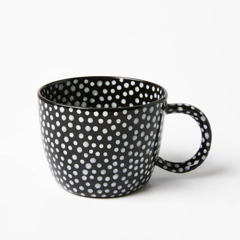 Black mug with white polka dot pattern on a white background by Jones and Co | Stockist at Zebra Finch Style in Newcastle, NSW