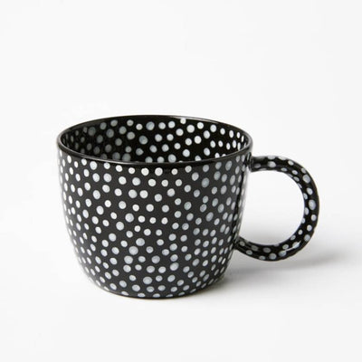 Black mug with white polka dot pattern on a white background by Jones and Co | Stockist at Zebra Finch Style in Newcastle, NSW