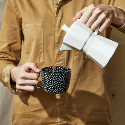 Black mug with white polka dot pattern on a white background by Jones and Co | Stockist at Zebra Finch Style in Newcastle, NSW