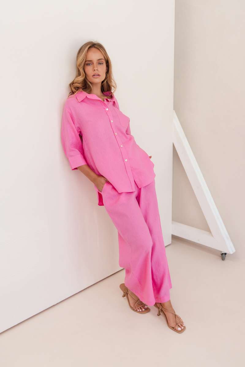 Woman wearing a bright pink outfit against a white background by Kaliedo