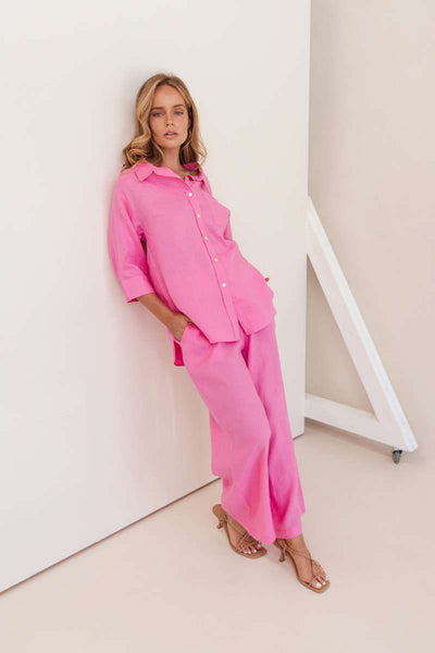 Woman wearing a bright pink outfit against a white background by Kaliedo