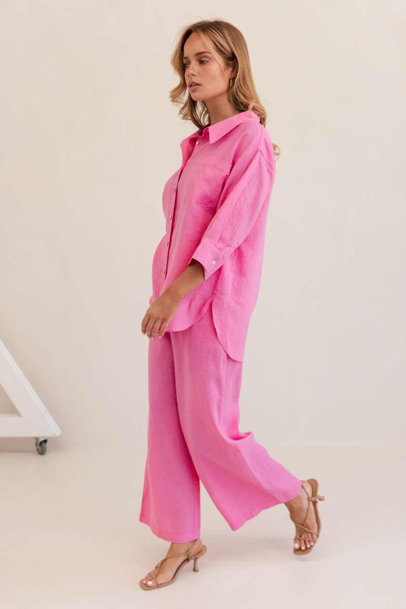 Woman wearing a bright pink outfit against a white background by Kaliedo