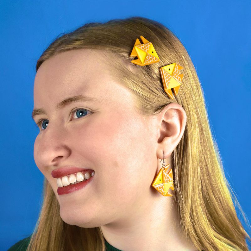 The Memorable Goldfsh hair clips set of two on model by Erstwilder, from their 2023 Origami collection