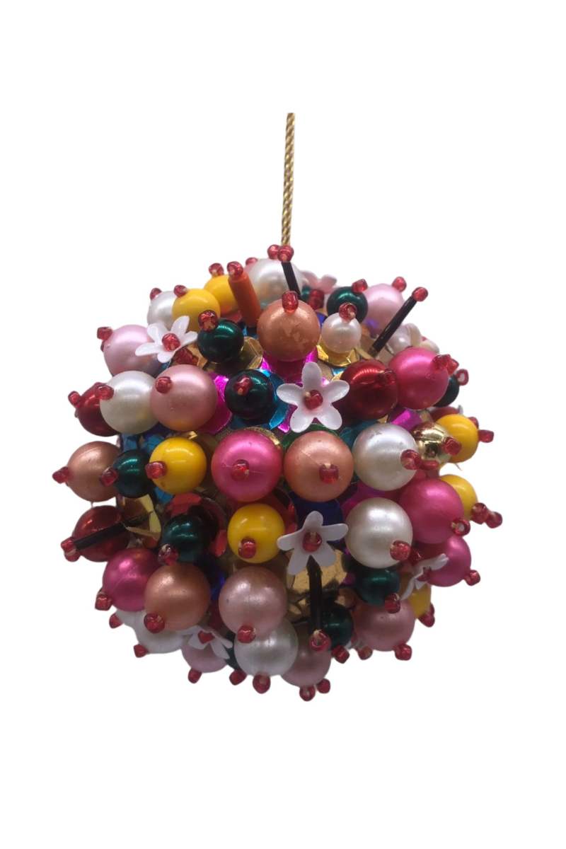 Colorful decorative sphere ornament with beads and flowers on a white background