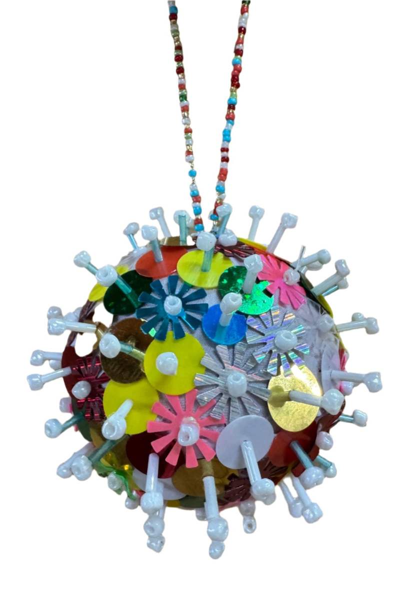 Colorful spherical ornament with white spikes on a white background