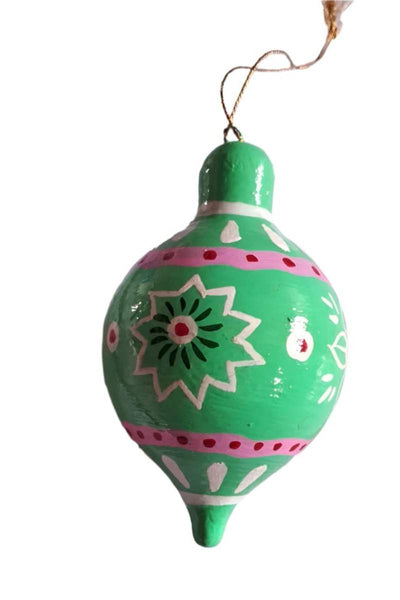 Decorative green ornament with floral patterns on a white background