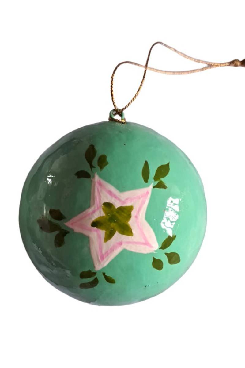 Decorative ornament christmas bauble with a star design on a white background