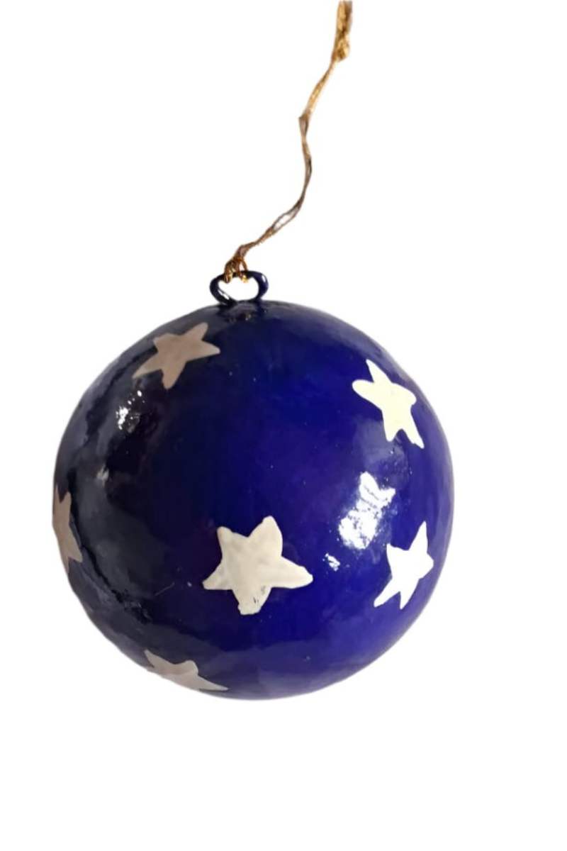 Blue spherical ornament christmas bauble with white star patterns on a white background