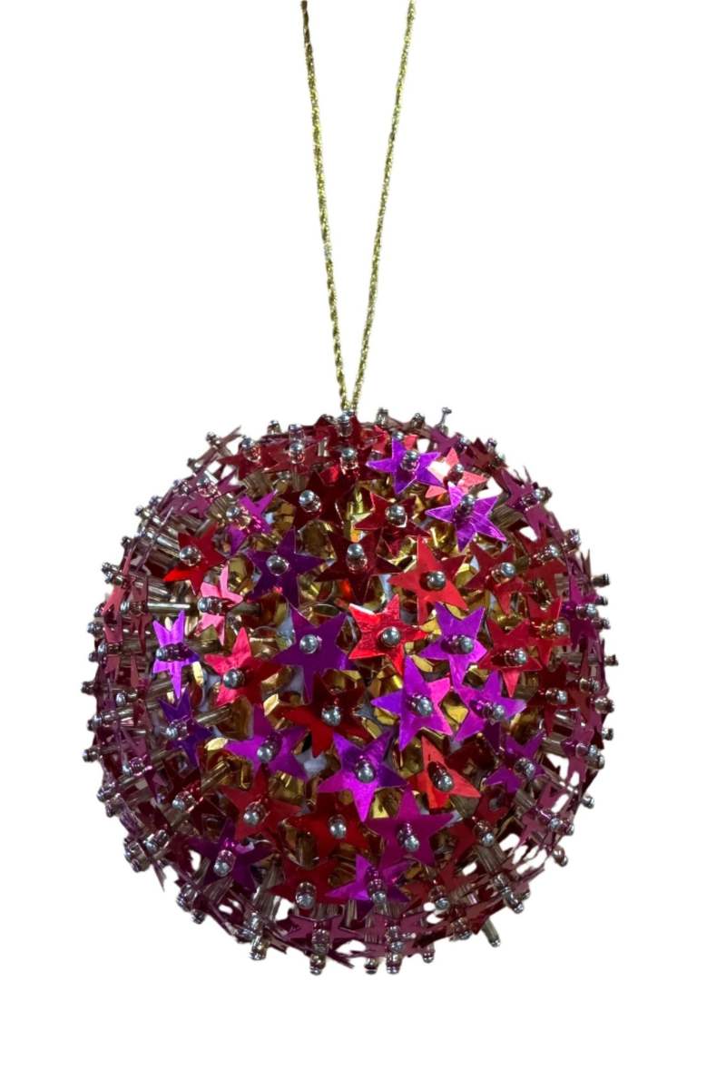 Decorative Christmas ball ornament with star-shaped cutouts on a white background