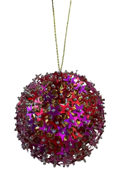 Decorative Christmas ball ornament with star-shaped cutouts on a white background
