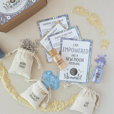 Potion kit with cards, bottles, and decorative items on a neutral background