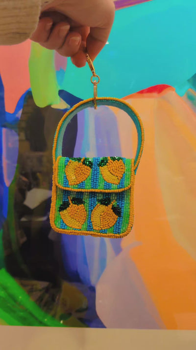 Beaded keychain purse with lemon design on a white background by Zoda | Stocked at Zebra Finch Style in Newcastle West