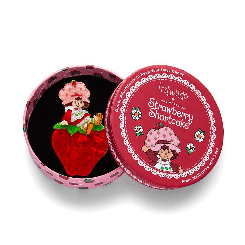 Sitting On A Strawberry Brooch in gift box by Erstwilder, from their 2024 Strawberry Shortcake Collection