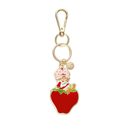 Sitting On A Strawberry Enamel Keyring by Erstwilder from their 2024 Strawberry Shortcake collection