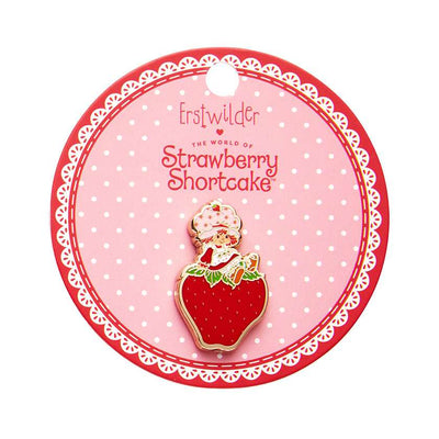 Sitting On A Strawberry Enamel Pin on cardboard backing by Erstwilder from their 2024 Strawberry Shortcake collection