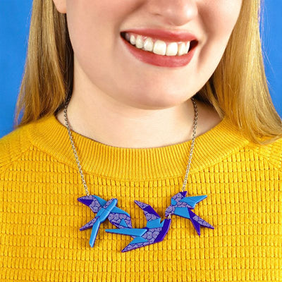 Sky dancers necklace on model by Erstwilder from their 2023 Origami collection