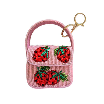 Pink beaded keychain with strawberry designs on a white background by Zoda | Stockist at Zebra Finch Style in Newcastle, NSW