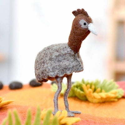 Felted emu figurine on a colorful background