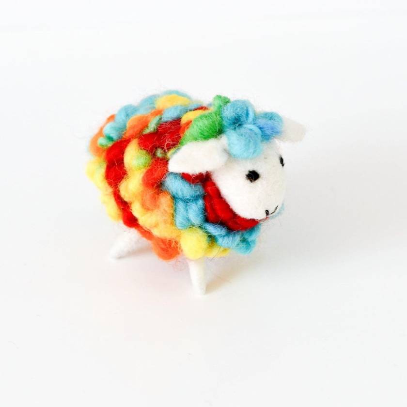Colorful sheep-shaped toy with a white background