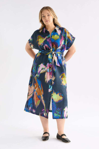 Woman wearing a colorful dress with a white background - the Lato dress by Elk the Label, stocked at Zebra Finch Style in Newcastle, NSW